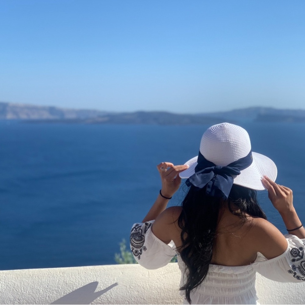 White beach hat with blue ribbon, bought and worn once in Greece!